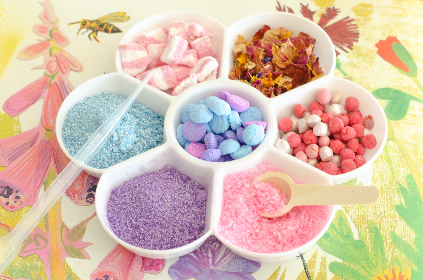 potion play accessories, including a flower potion play tray, a pipette and small wooden spoon for potion play