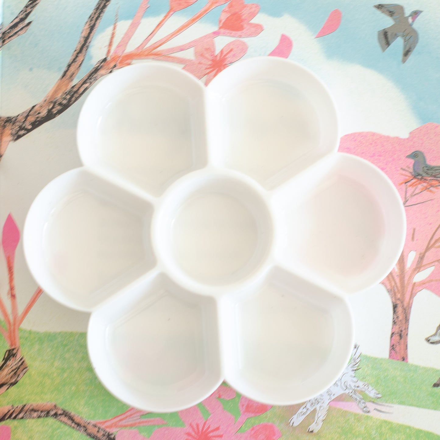 white plastic potion sensory tray with 7 compartments, ideal for small loose parts play and sensory play