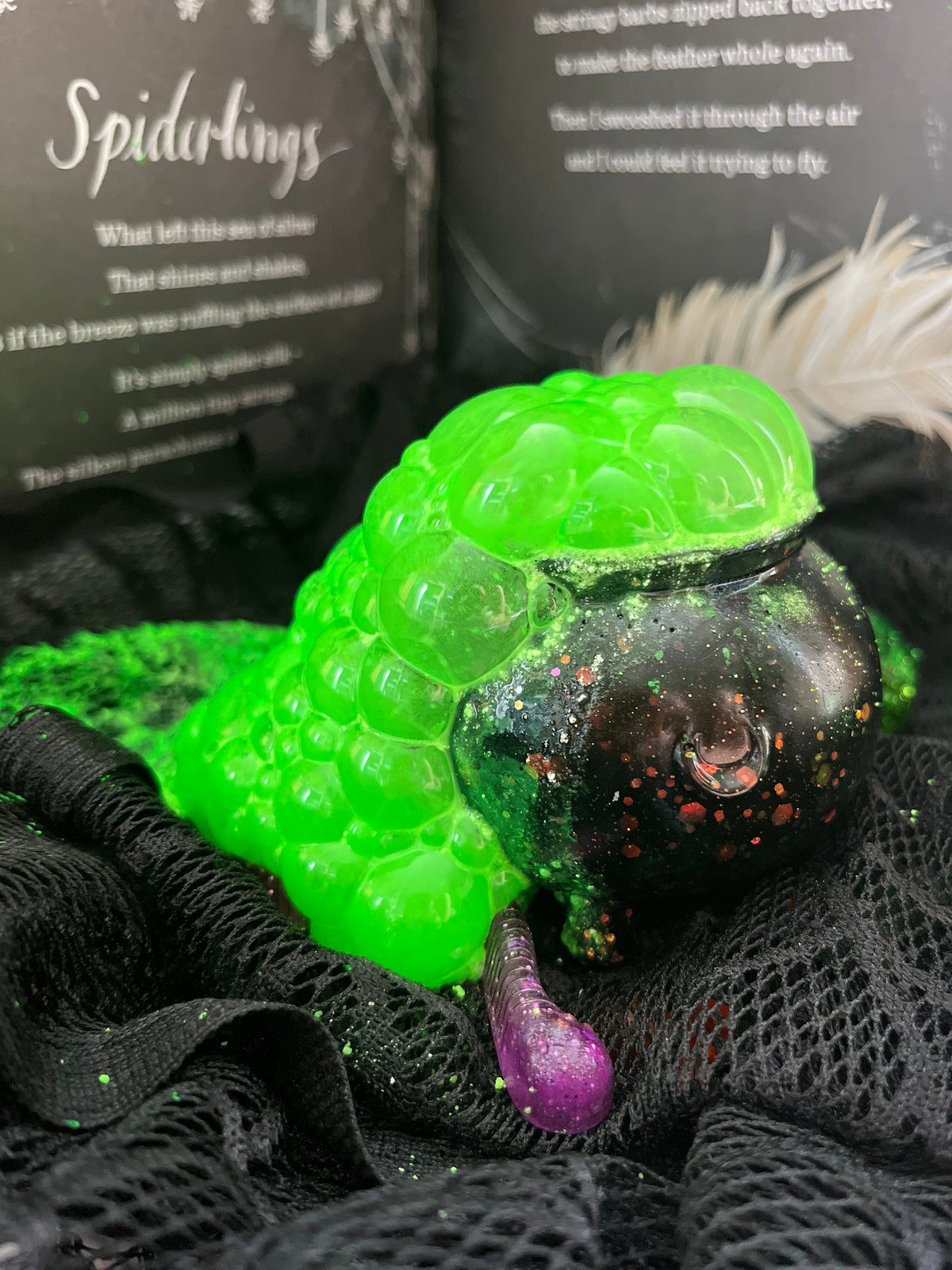 Cherry Bumbles Halloween Potion Kit. Showing a neon green fizzy potion bubbling out of a black cauldron.