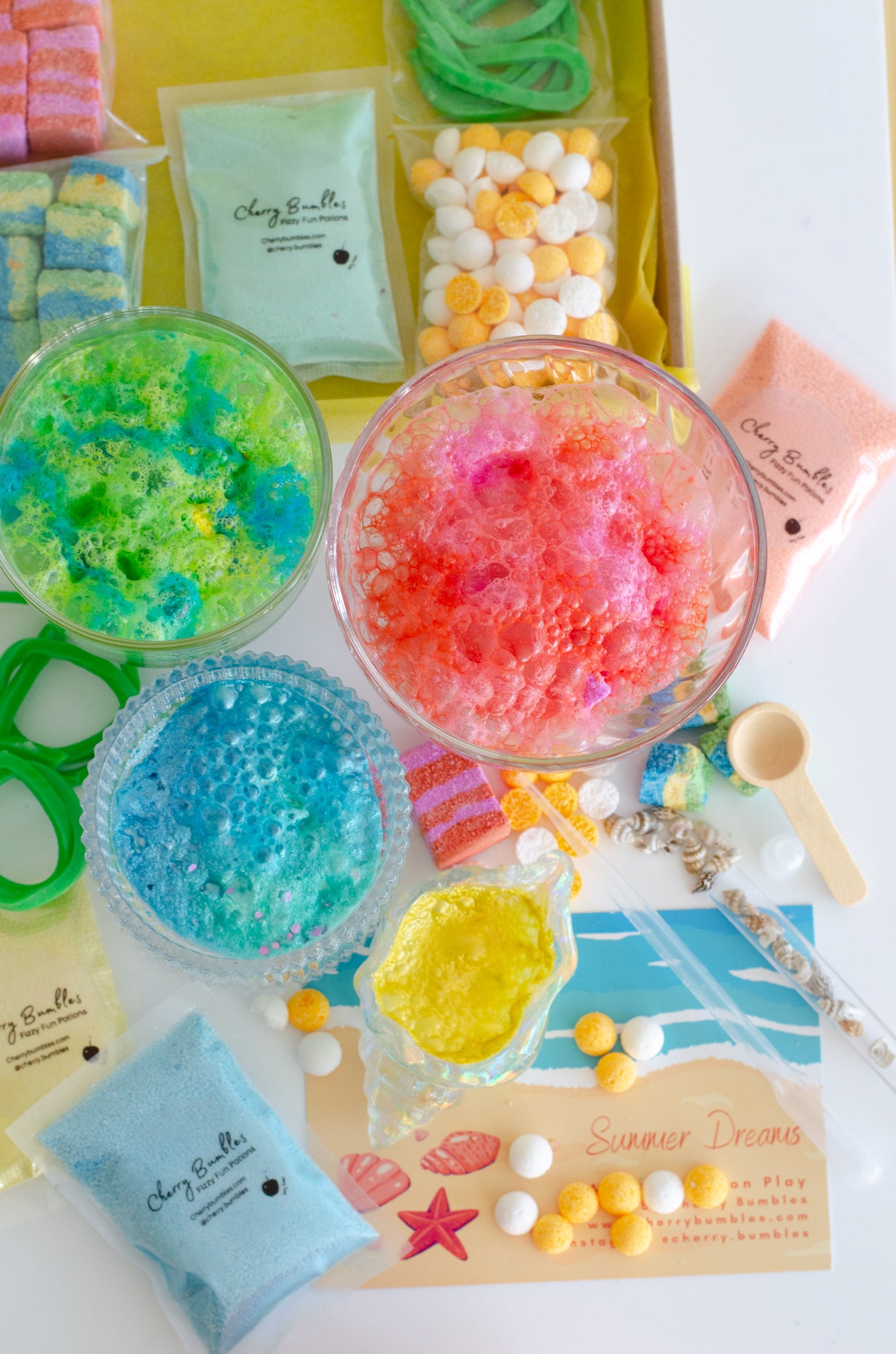 Summer sensory play activity for children. Potion making kit in vibrant colours that fizz and foam. 